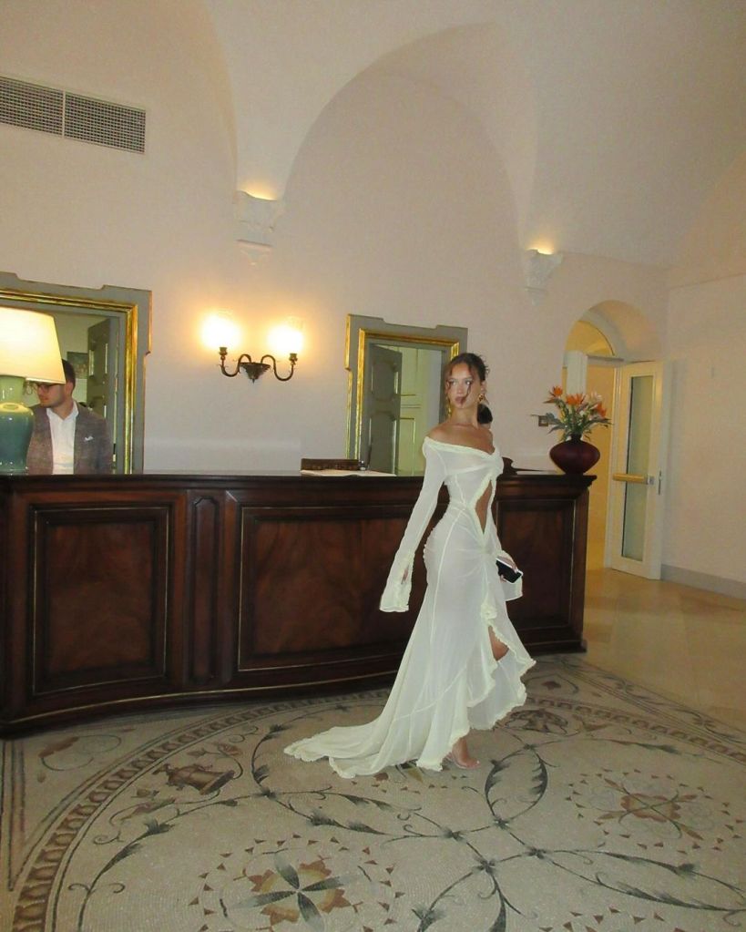 The Aussie influencer, who has over a million followers, posted a photo dump on Instagram that included photos of her wearing a floor-length, partially see-through yellow dress. 